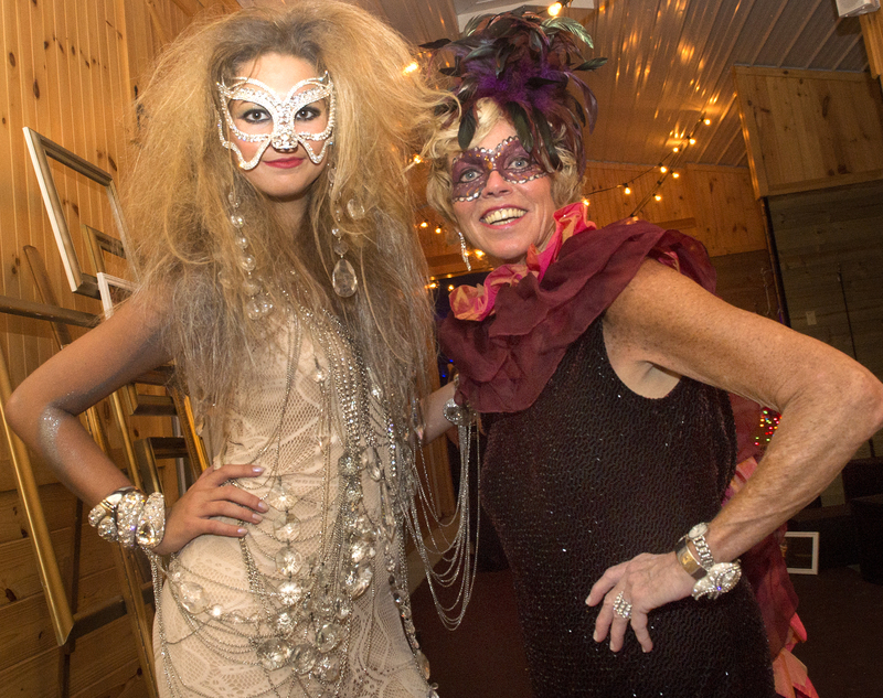 Ginny Daly, Beaux Arts Ball co-chair, right, channels a modern day Mrs. Corkran while posing with 'chandelier' Jessica Stevenson. BY DENY HOWETH